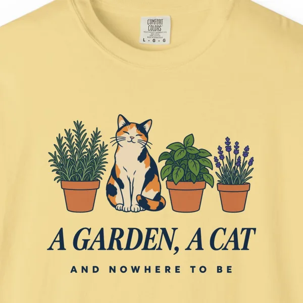 a-garden-a-cat-tee-butter-chest Close-up of the A Garden a Cat print on a Butter Comfort Colors 1717 tee