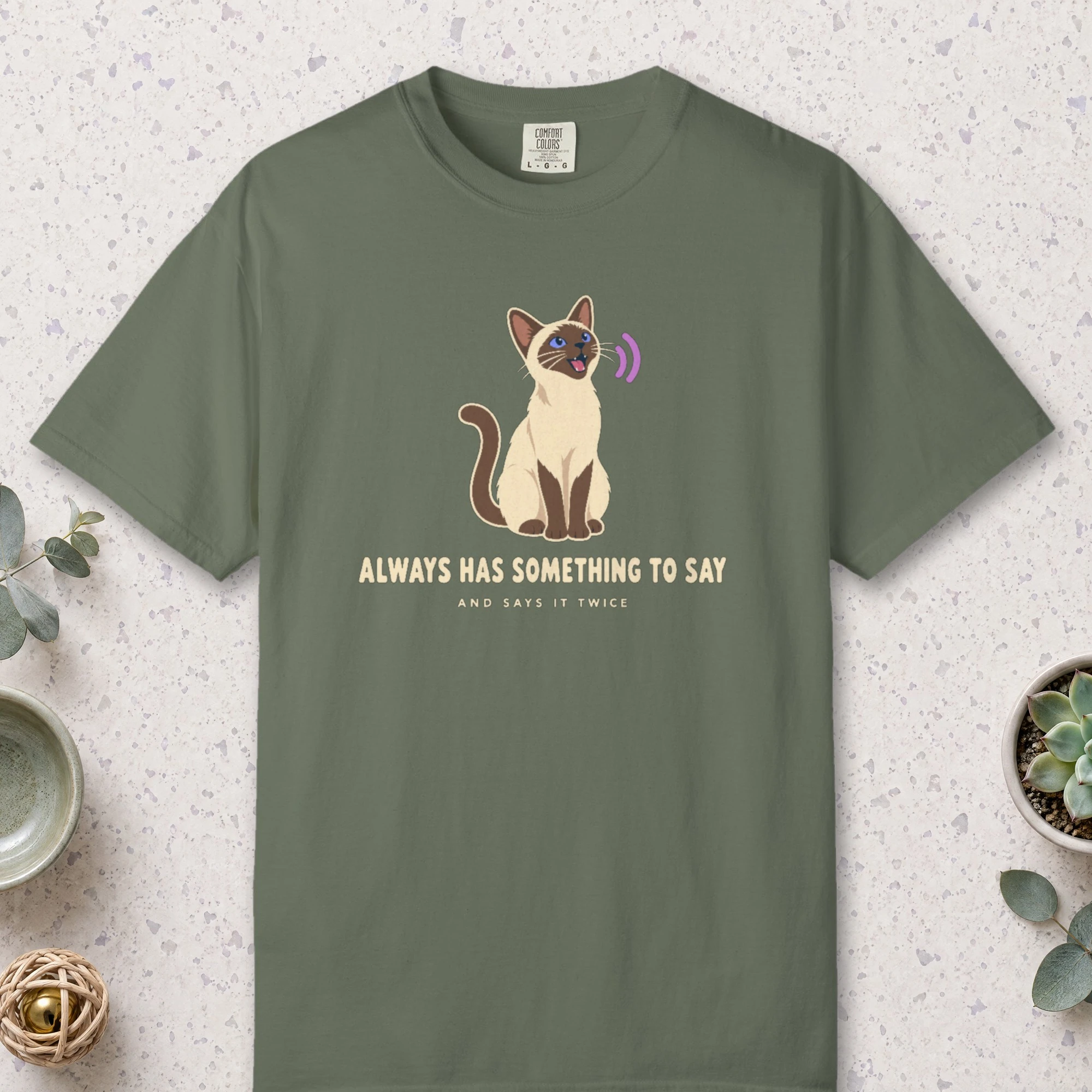 Always Has Something to Say design on a Moss Comfort Colors 1717 tee, laid flat