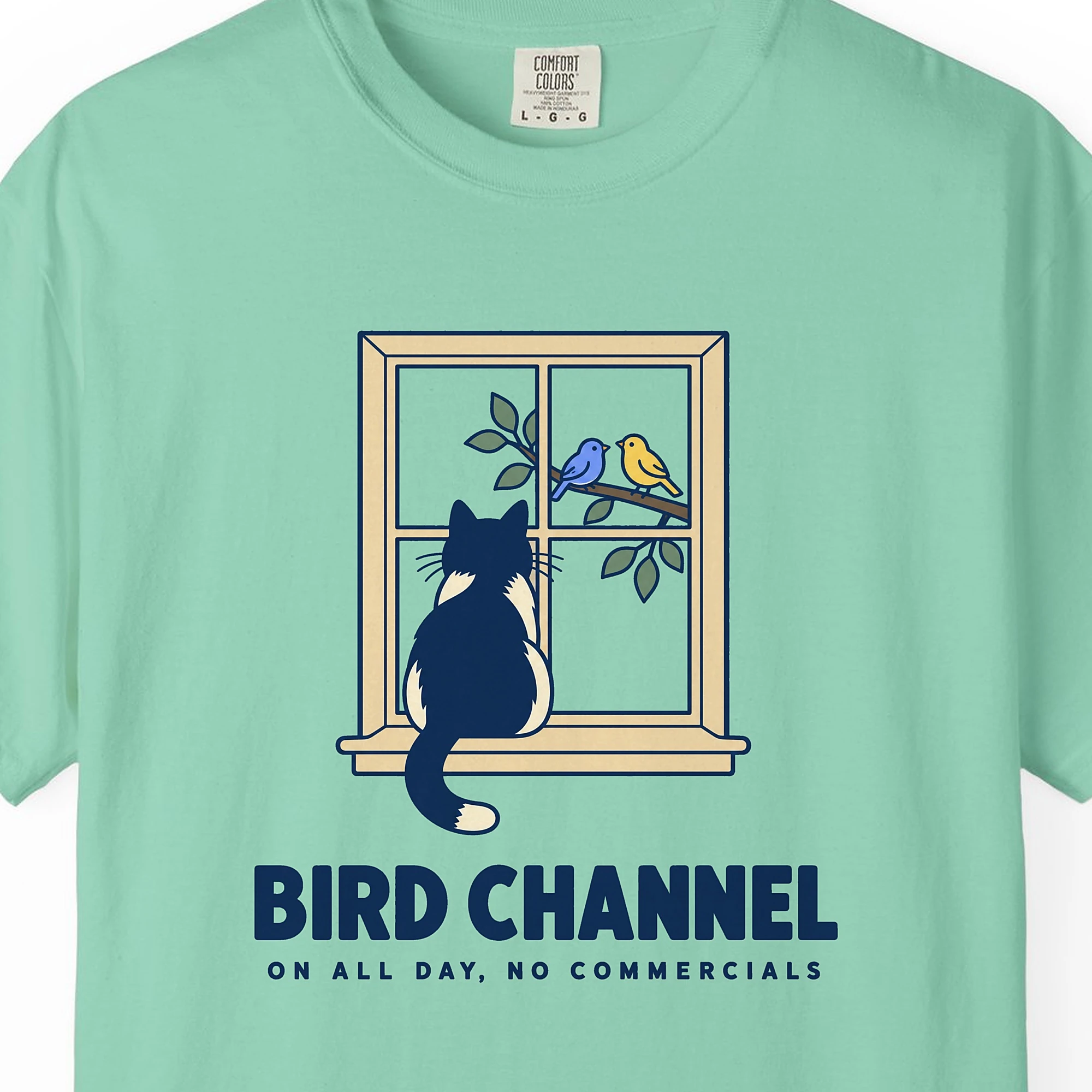 Close-up of the Bird Channel print on an Island Reef Comfort Colors 1717 tee