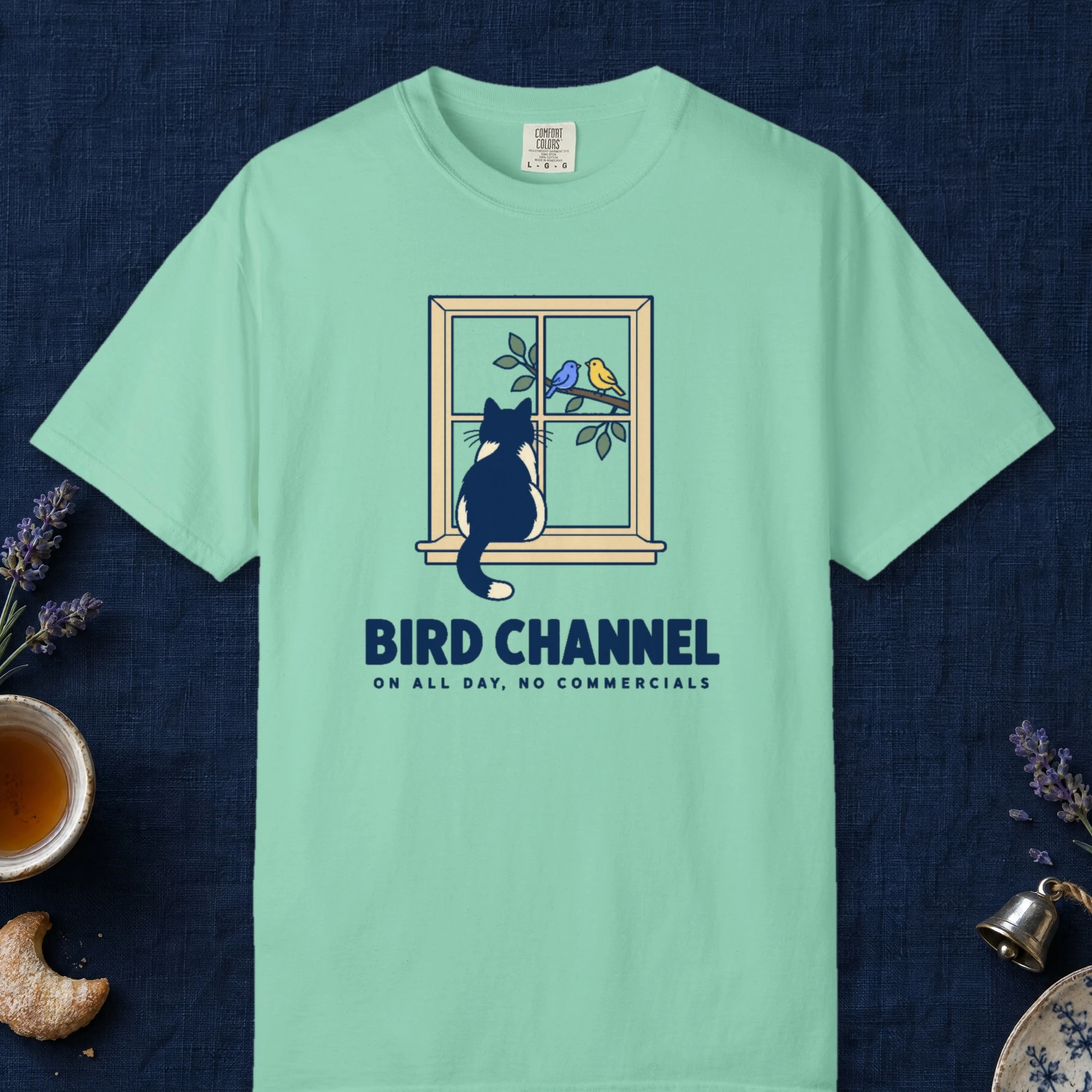Bird Channel design on an Island Reef Comfort Colors 1717 tee, laid flat