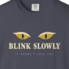 Close-up of the Blink Slowly print on a Navy Comfort Colors 1717 tee