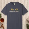 Blink Slowly design on a Navy Comfort Colors 1717 tee, laid flat