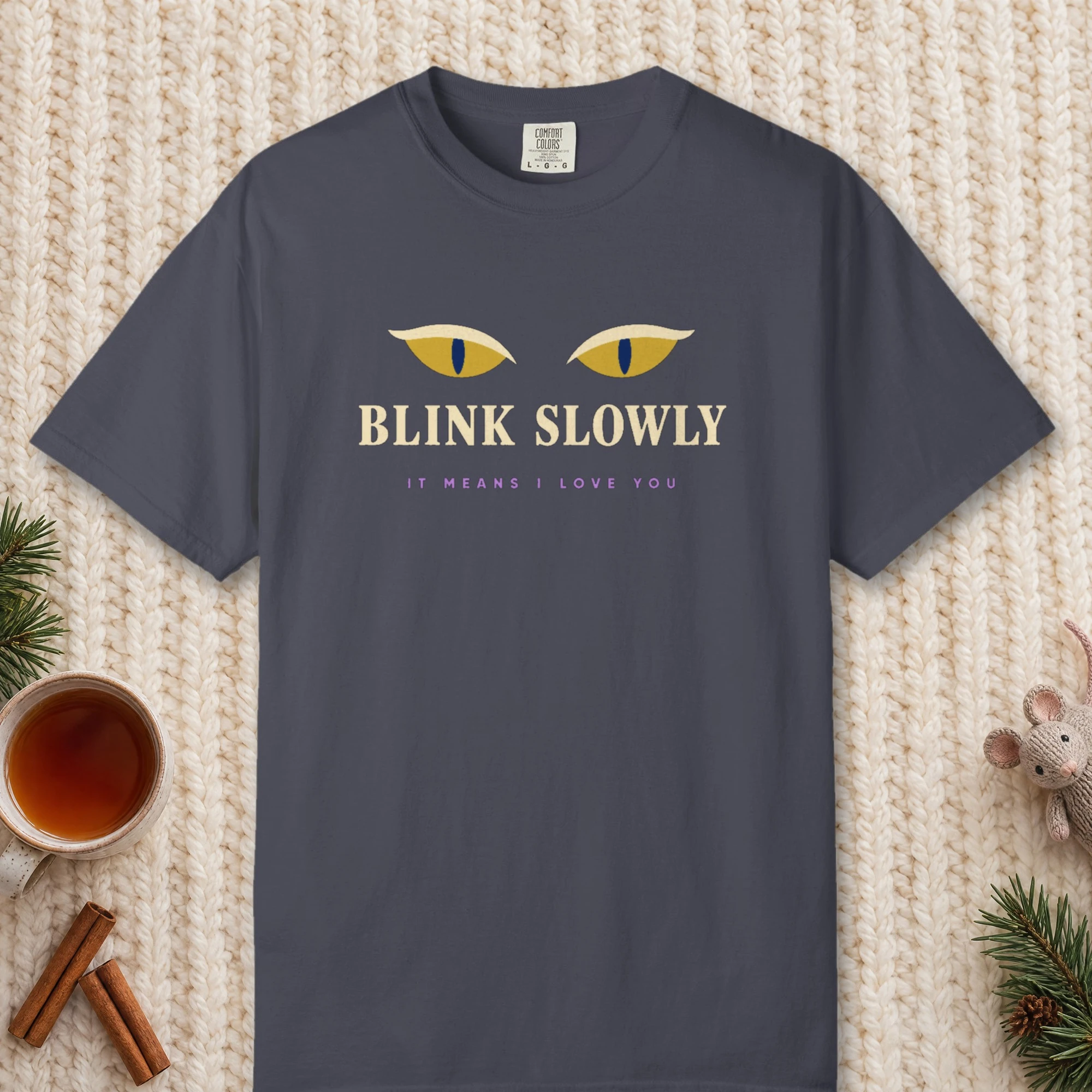 Blink Slowly design on a Navy Comfort Colors 1717 tee, laid flat