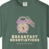 Close-up of the Breakfast Negotiations print on a Blue Spruce Comfort Colors 1717 tee