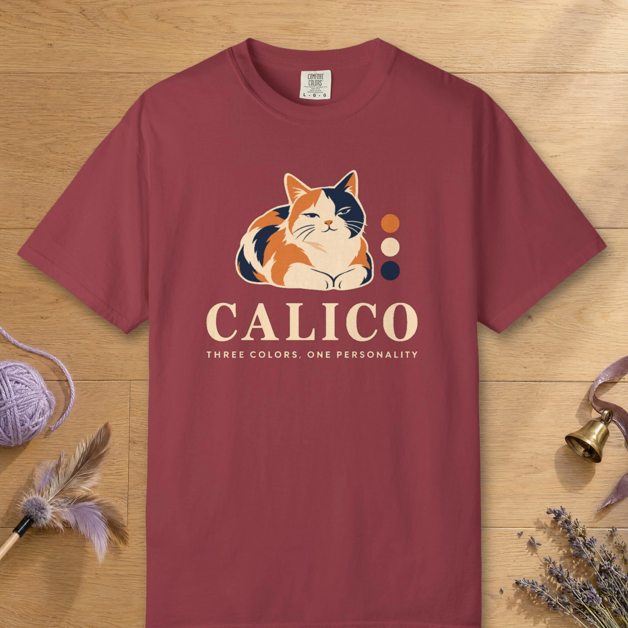 Calico design on a Chili Comfort Colors 1717 tee, laid flat