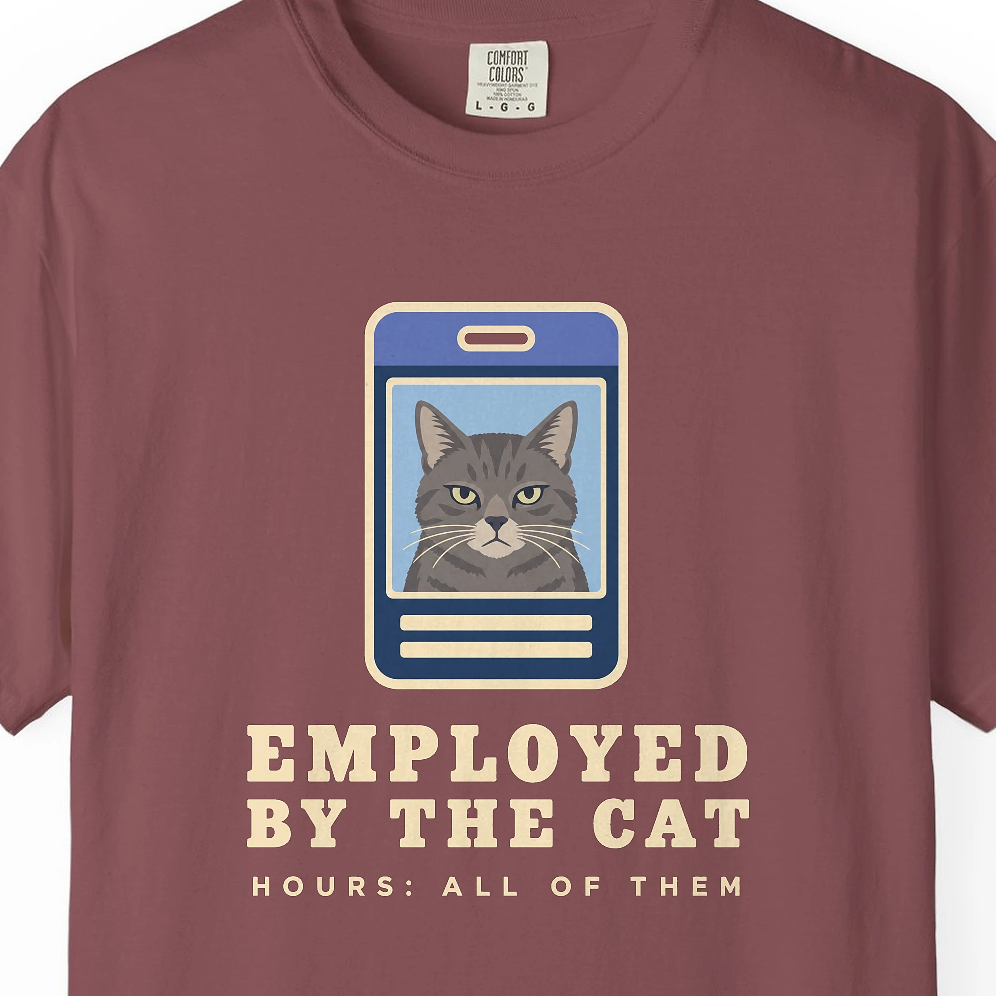 Close-up of the Employed by the Cat print on a Brick Comfort Colors 1717 tee