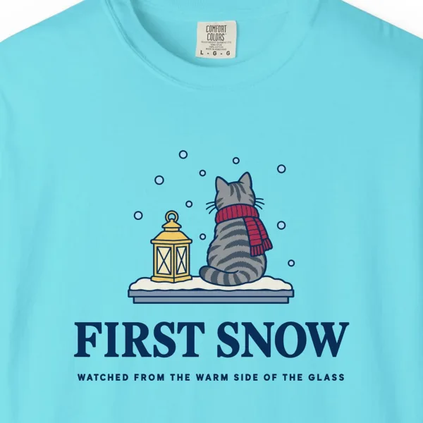 first-snow-tee-lagoon-blue-chest Close-up of the First Snow print on a Lagoon Blue Comfort Colors 1717 tee