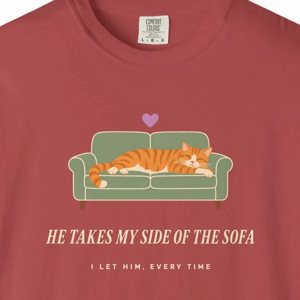 he-takes-my-side-of-the-sofa-tee-crimson-chest Close-up of the He Takes My Side of the Sofa print on a Crimson Comfort Colors 1717 tee