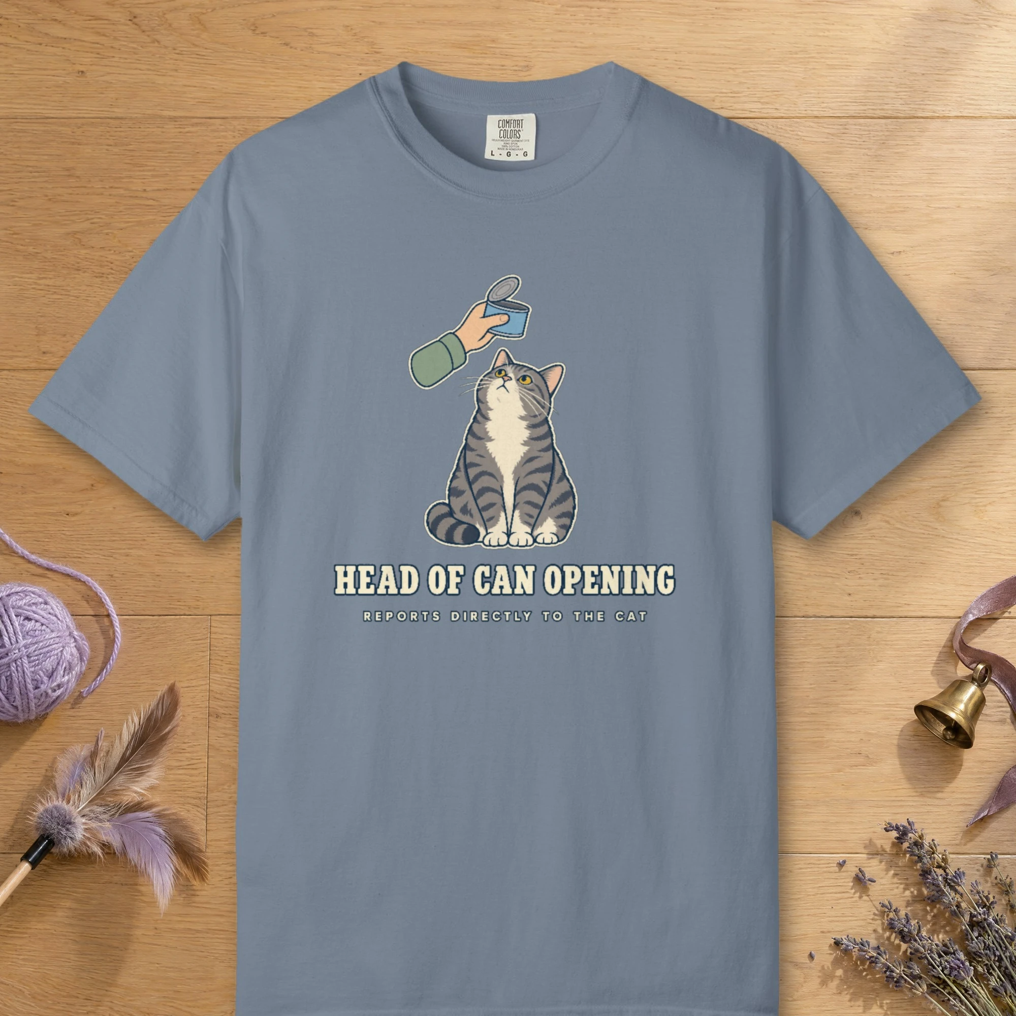 Head of Can Opening design on a Blue Jean Comfort Colors 1717 tee, laid flat