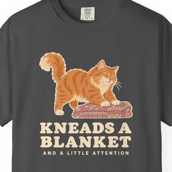 kneads-a-blanket-tee-graphite-chest Close-up of the Kneads a Blanket print on a Graphite Comfort Colors 1717 tee