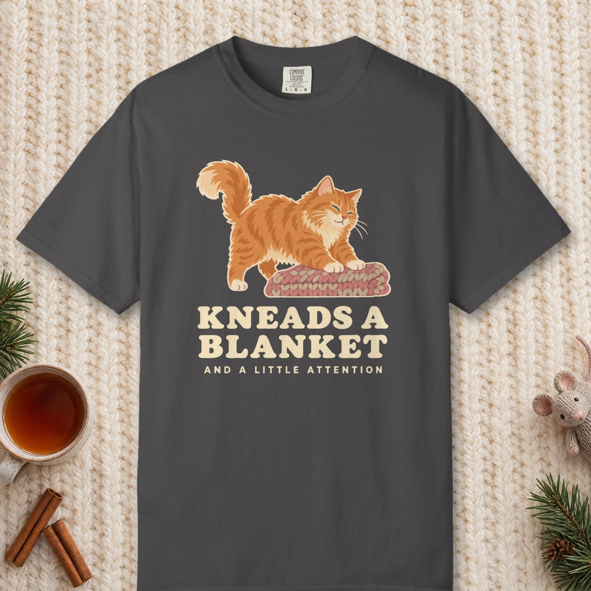Kneads a Blanket design on a Graphite Comfort Colors 1717 tee, laid flat
