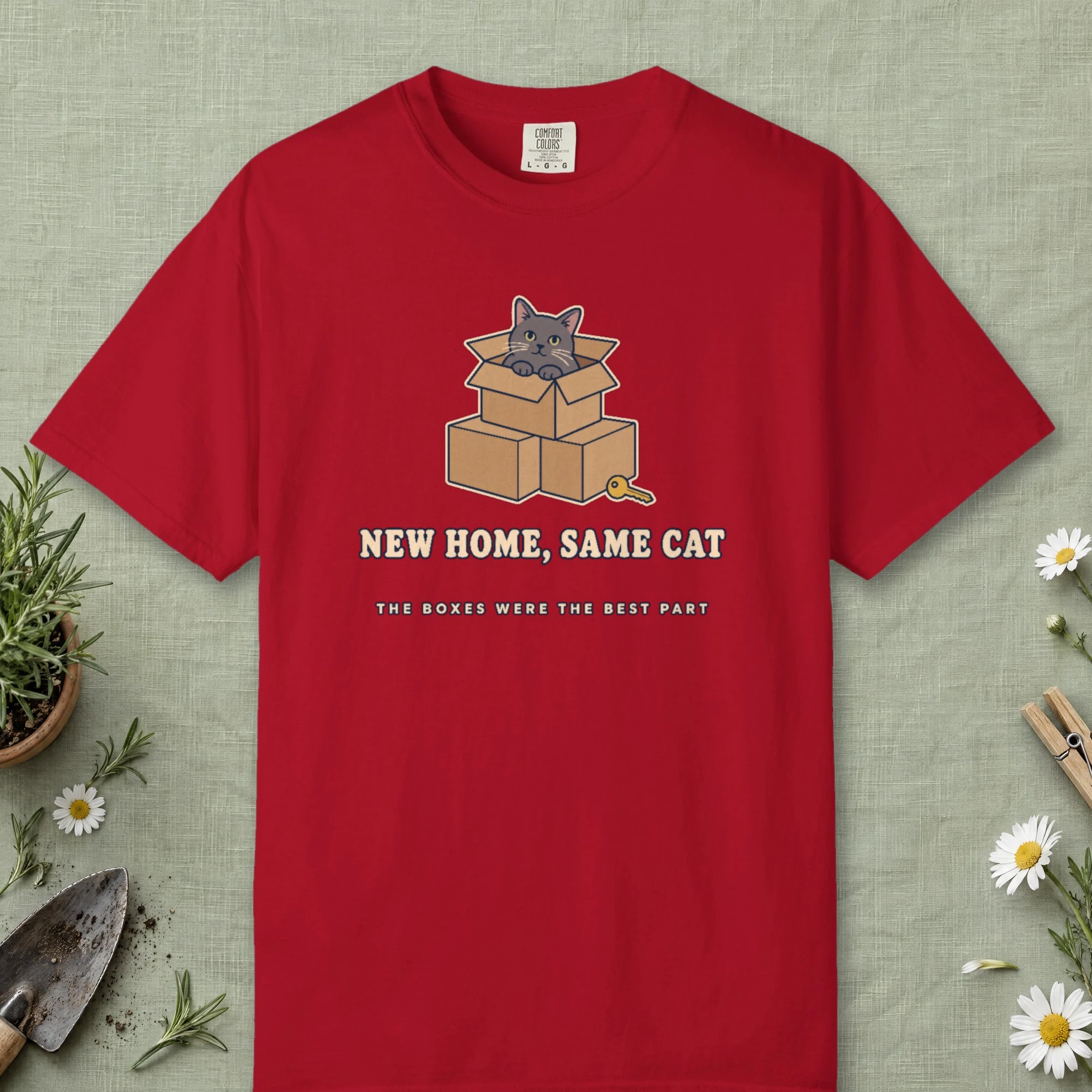New Home, Same Cat design on a Red Comfort Colors 1717 tee, laid flat