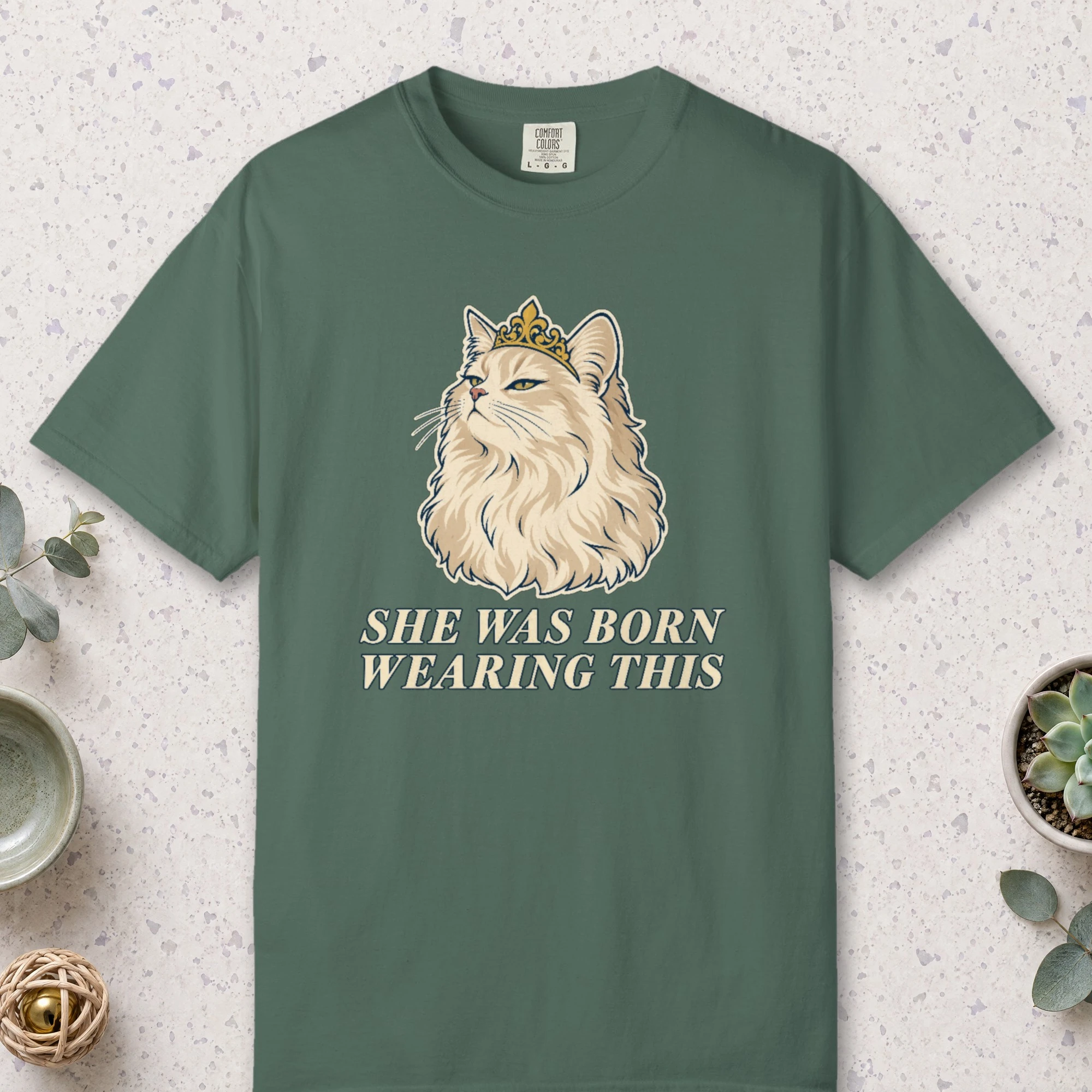She Was Born Wearing This design on a Blue Spruce Comfort Colors 1717 tee, laid flat