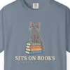 Close-up of the Sits on Books print on a Blue Jean Comfort Colors 1717 tee
