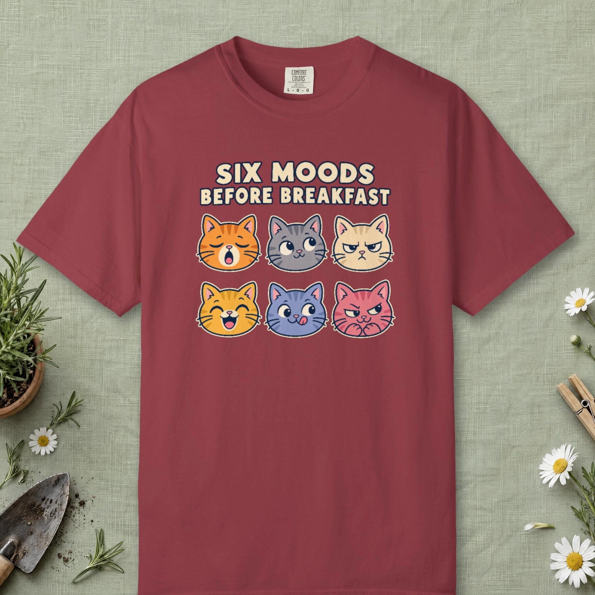 Six Moods Before Breakfast design on a Chili Comfort Colors 1717 tee, laid flat