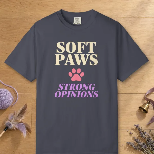 Soft Paws Strong Opinions design on a Navy Comfort Colors 1717 tee, laid flat