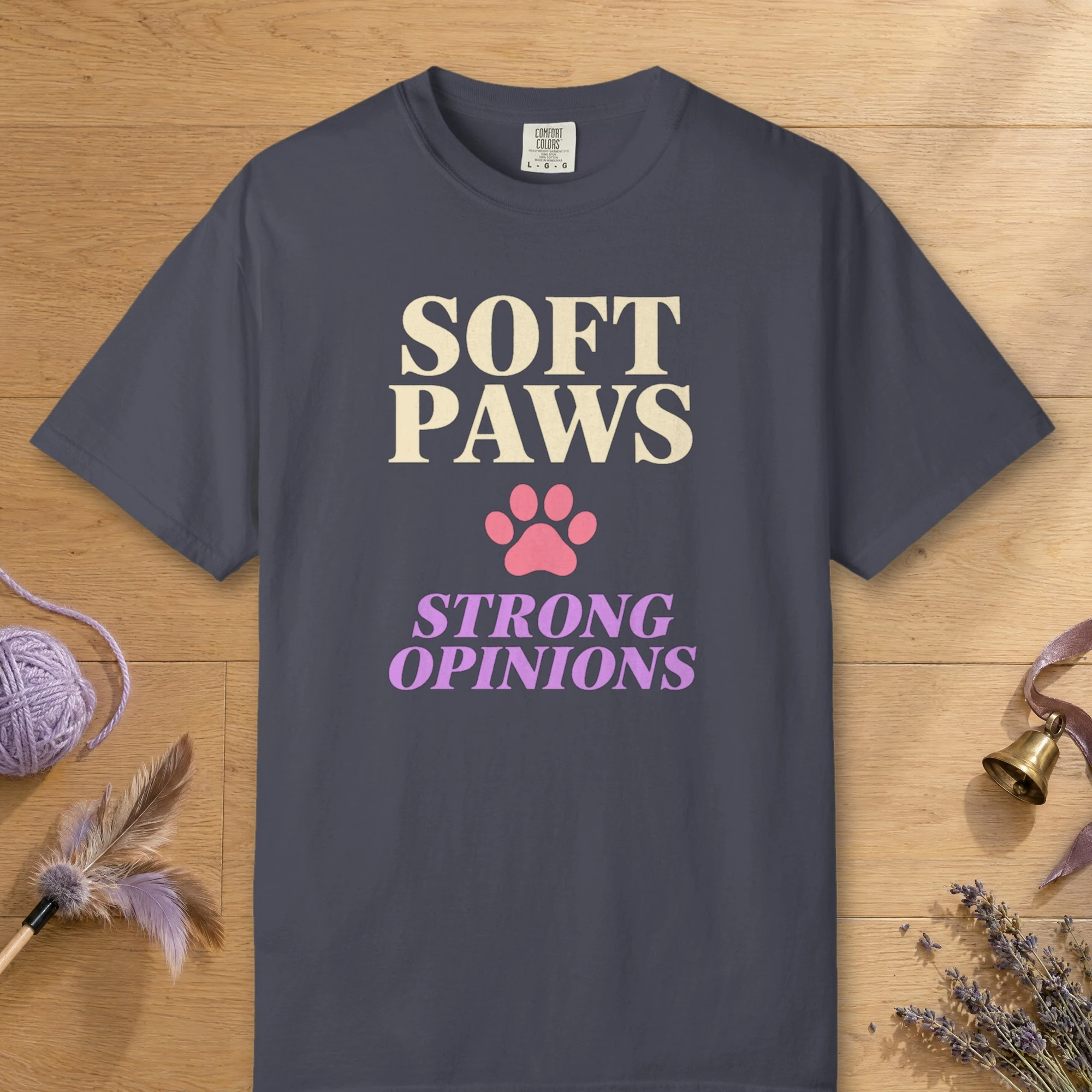 Soft Paws Strong Opinions design on a Navy Comfort Colors 1717 tee, laid flat