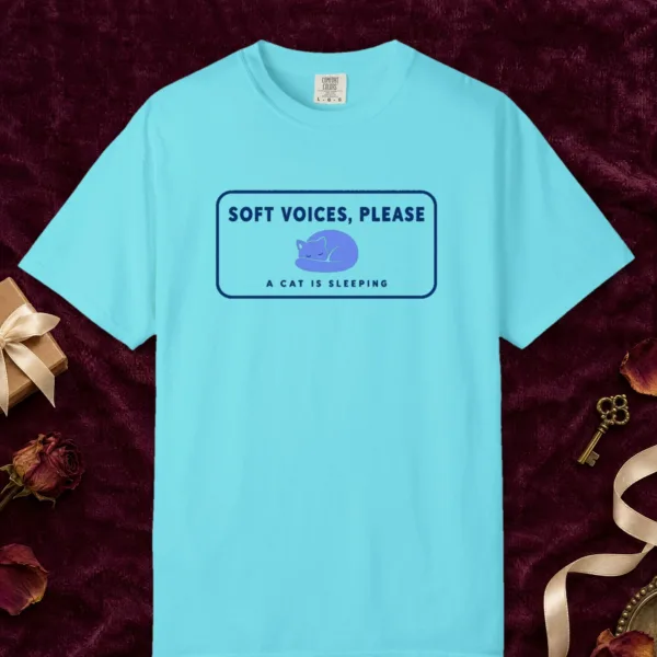 Soft Voices Please design on a Lagoon Blue Comfort Colors 1717 tee, laid flat
