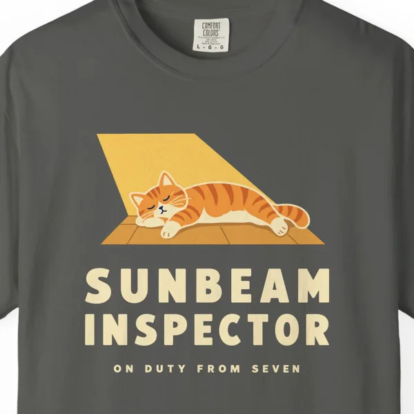 Close-up of the Sunbeam Inspector print on a Pepper Comfort Colors 1717 tee
