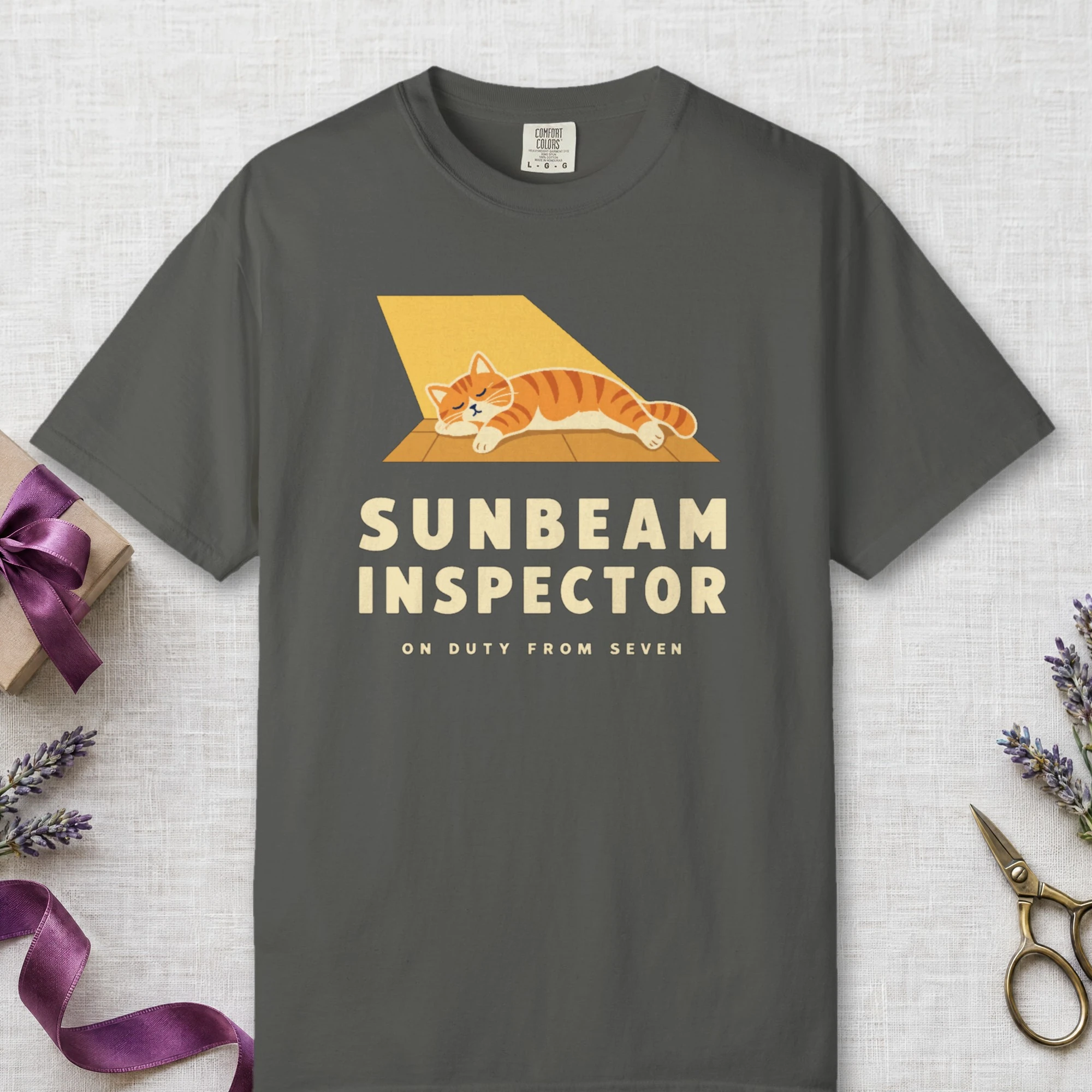 Sunbeam Inspector design on a Pepper Comfort Colors 1717 tee, laid flat