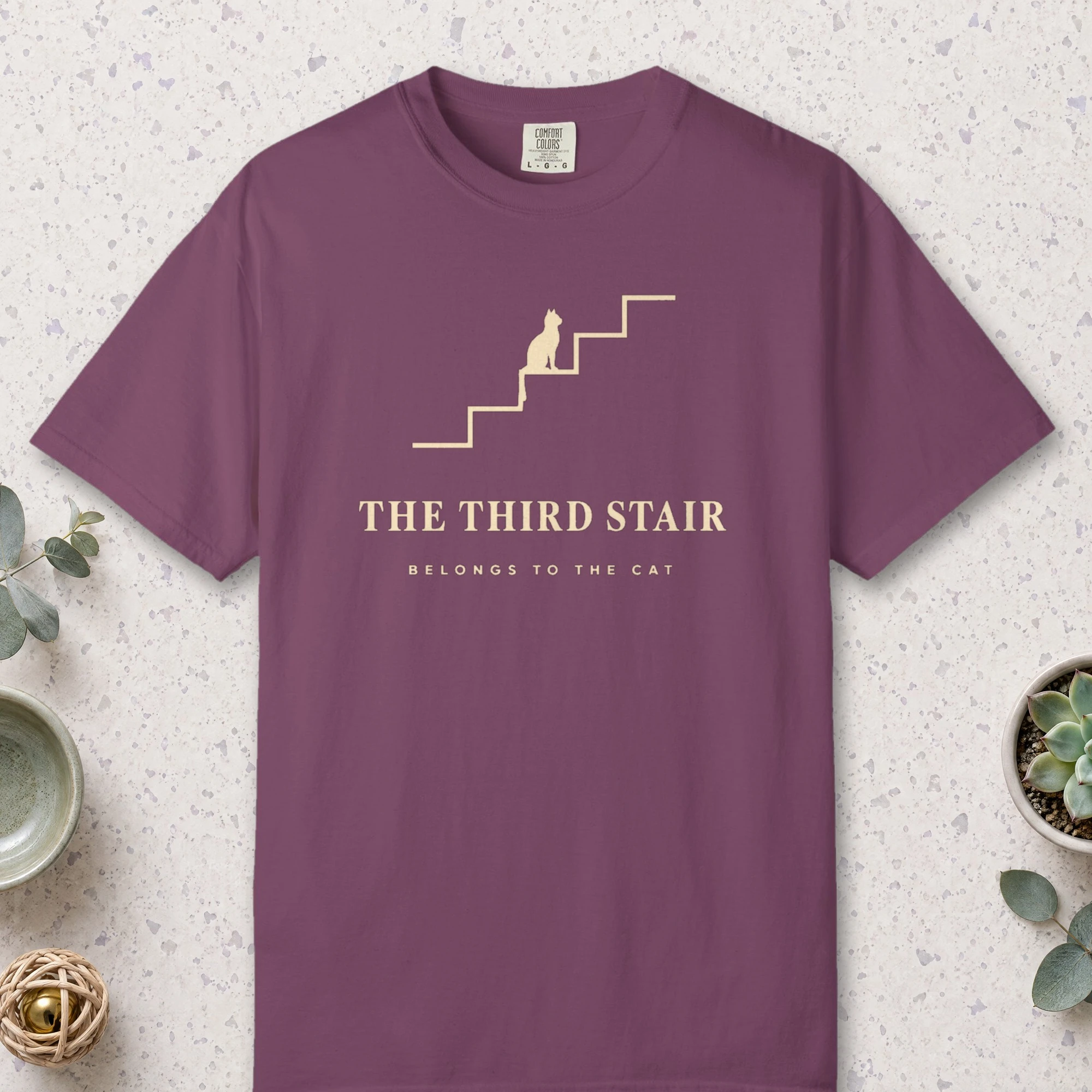 The Third Stair design on a Berry Comfort Colors 1717 tee, laid flat