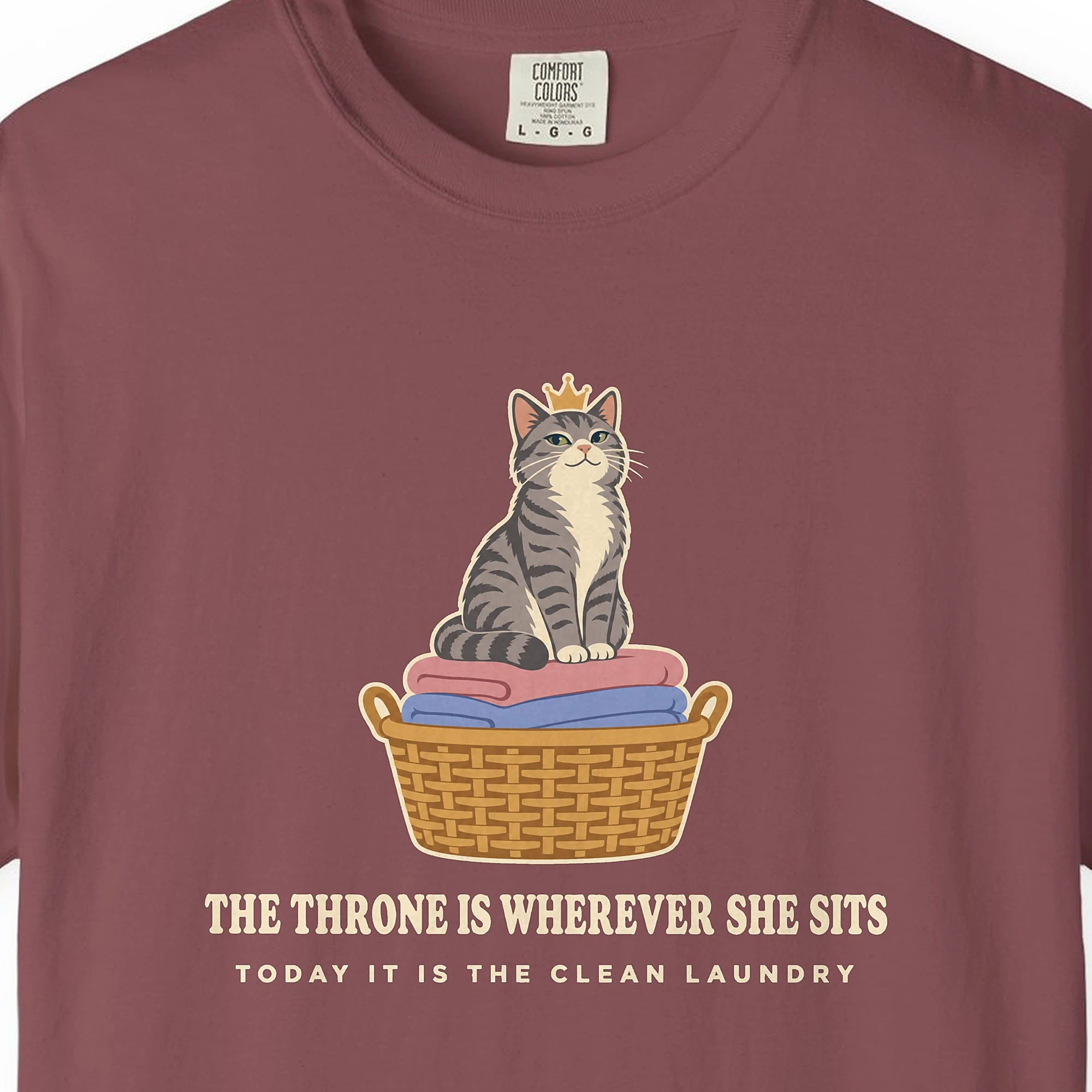 Close-up of the The Throne Is Wherever She Sits print on a Brick Comfort Colors 1717 tee