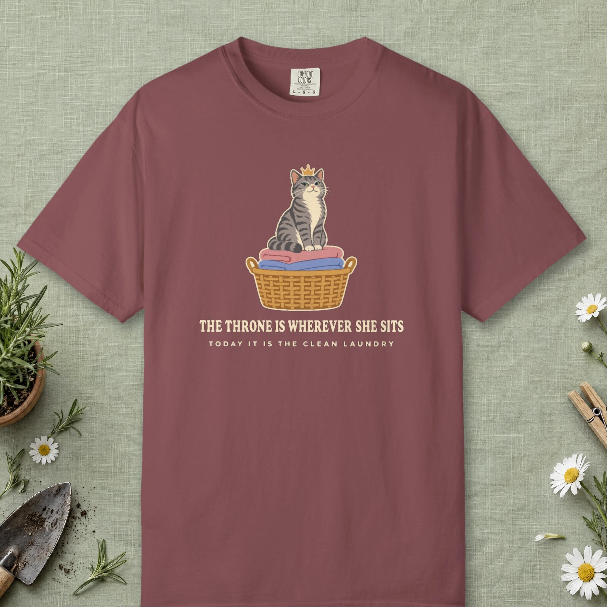 The Throne Is Wherever She Sits design on a Brick Comfort Colors 1717 tee, laid flat