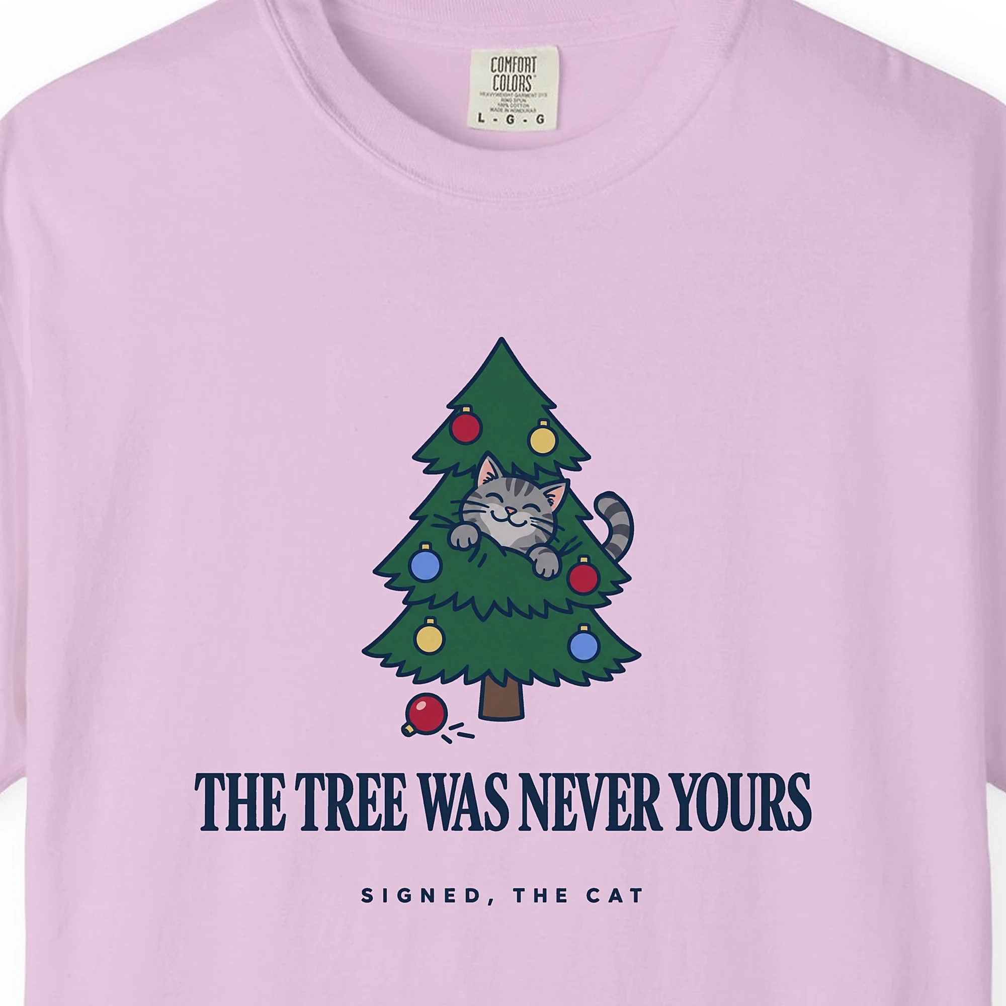 Close-up of the The Tree Was Never Yours print on an Orchid Comfort Colors 1717 tee