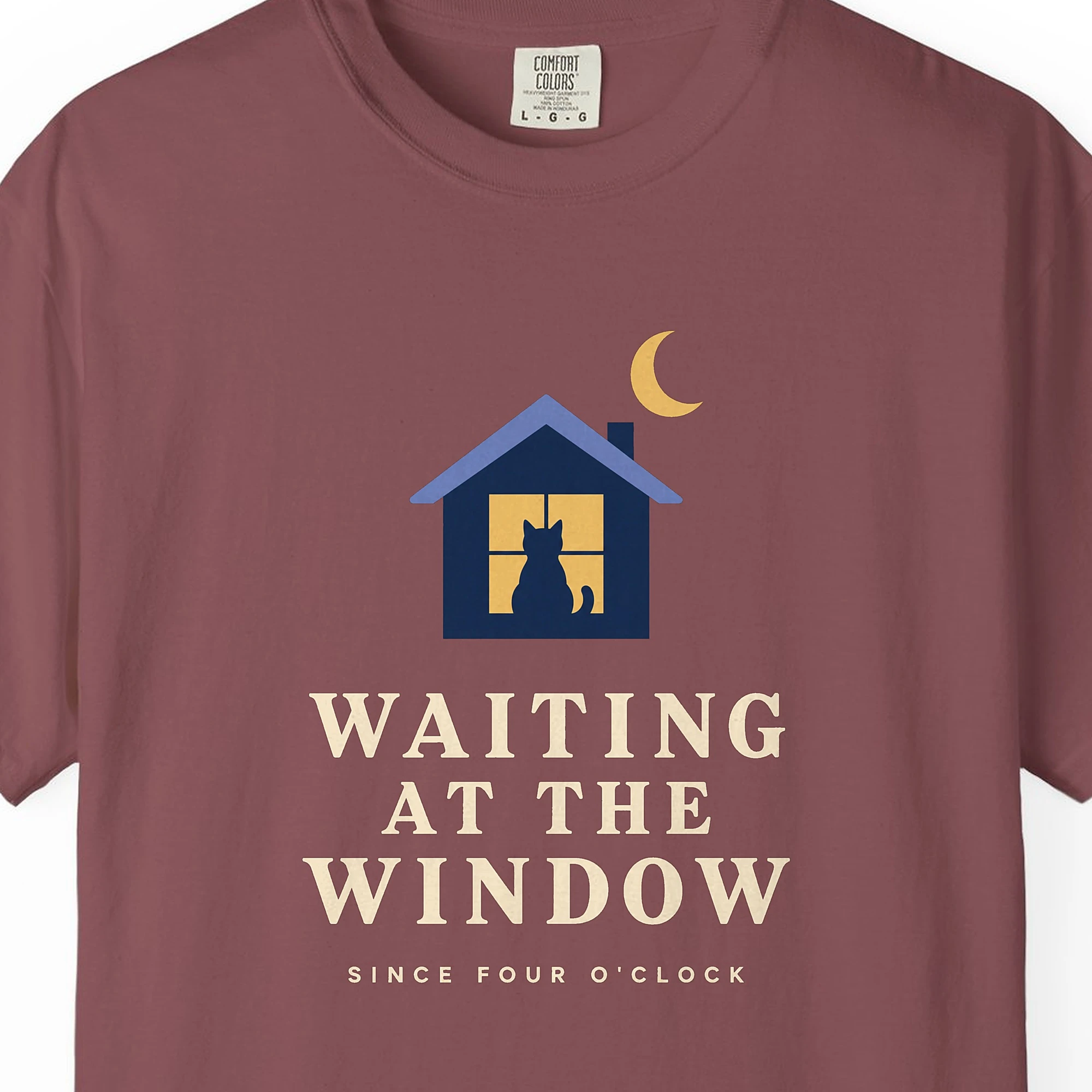 Close-up of the Waiting at the Window print on a Brick Comfort Colors 1717 tee
