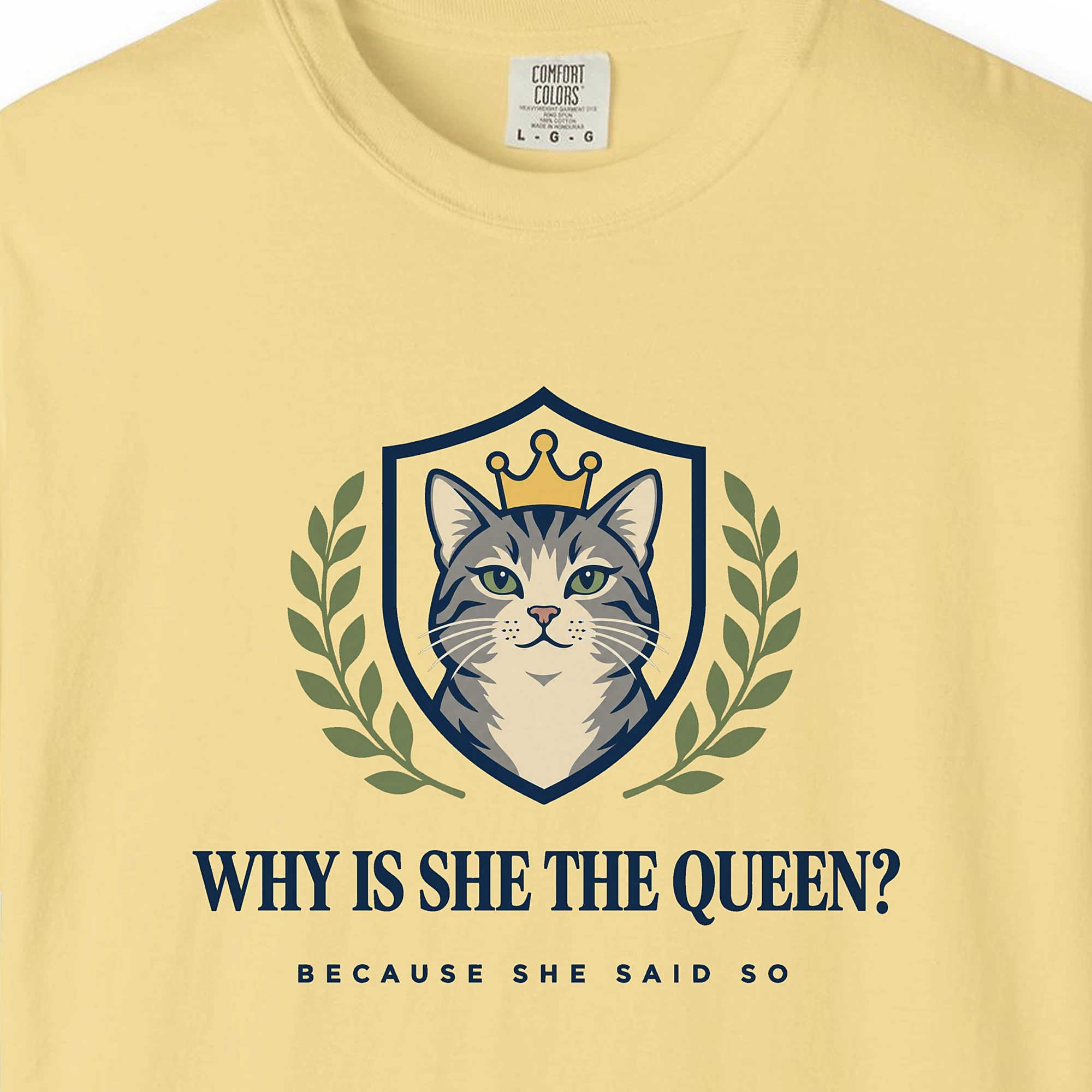 Close-up of the Why Is She the Queen print on a Butter Comfort Colors 1717 tee