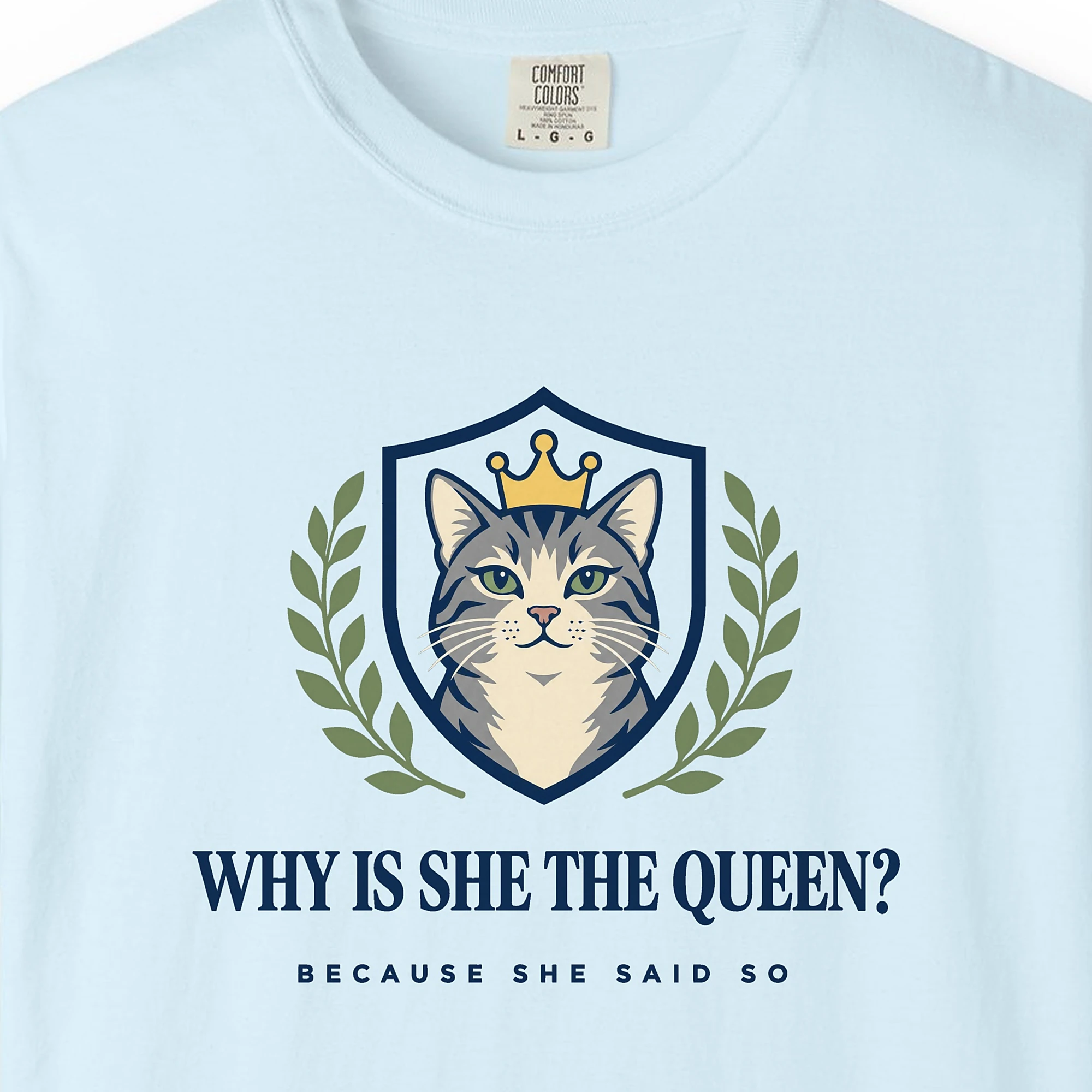 Close-up of the Why Is She the Queen print on a Chambray Comfort Colors 1717 tee