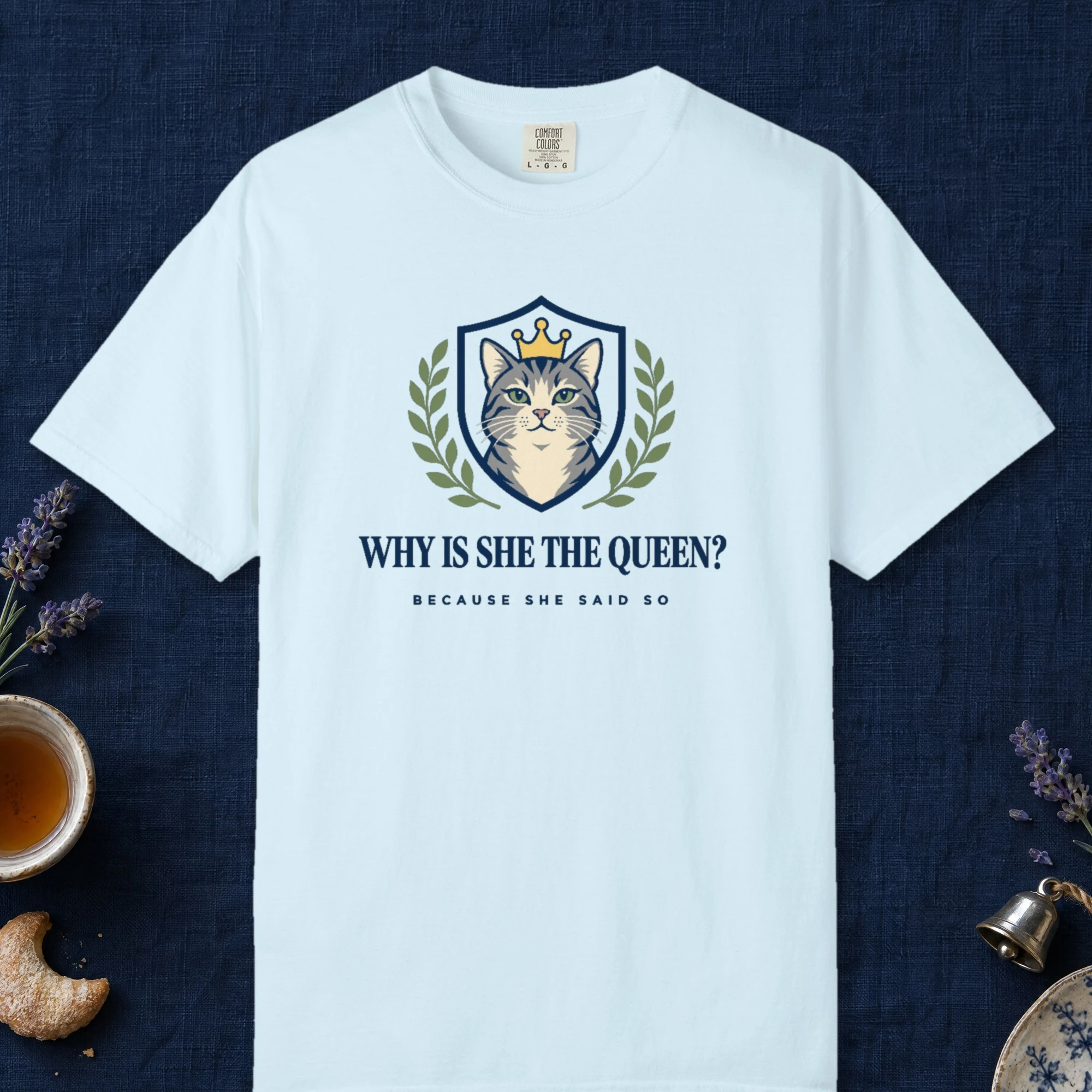 Why Is She the Queen design on a Chambray Comfort Colors 1717 tee, laid flat